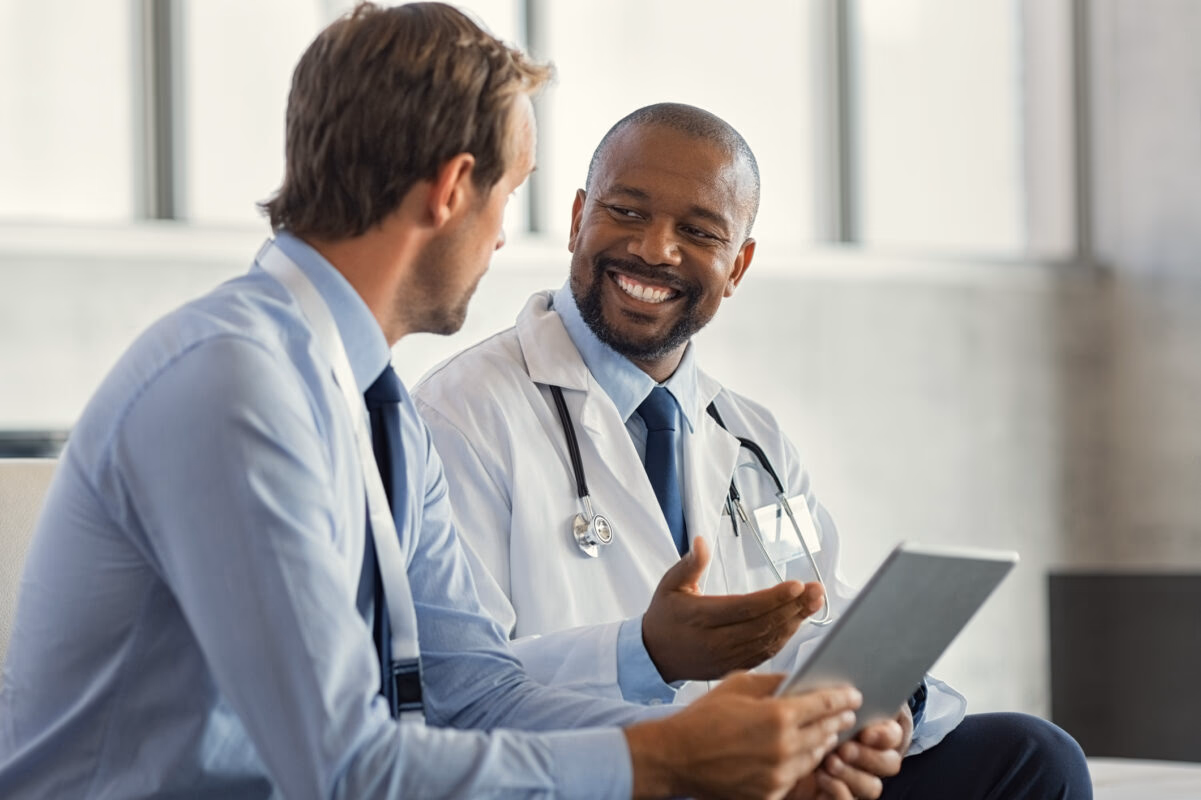 Two healthcare professionals in clinical consultation