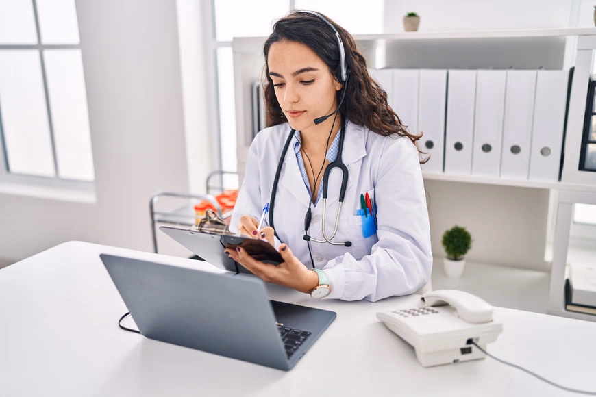 Healthcare professional working with Clearpol on a laptop